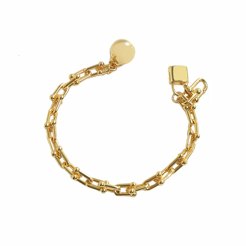 

New Design Chic Modern U Shape Shackle 18k Gold Plated Single Loop Slubby Chain with Hanging Ball Lock Charm Pendant Bracelet