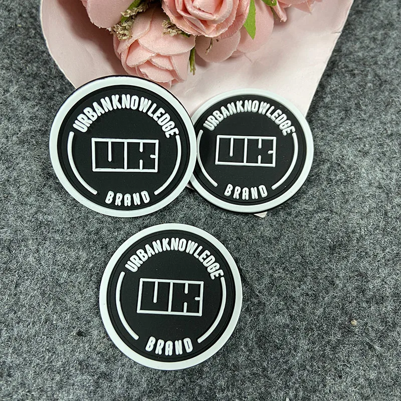 

Hot sale custom logo thick round rubber labels for clothing jeans rubber patch sew on clothing, Blue, black , white, red, yellow or custom color