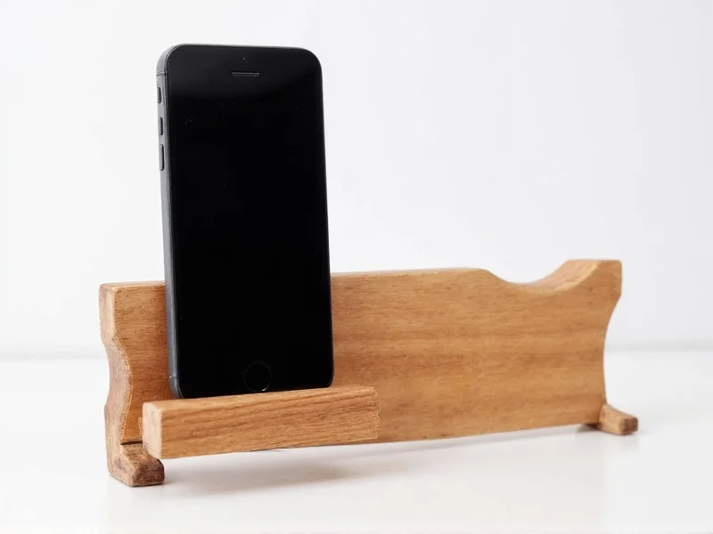 Minimalist wooden phone holder crafted from salvaged lumber