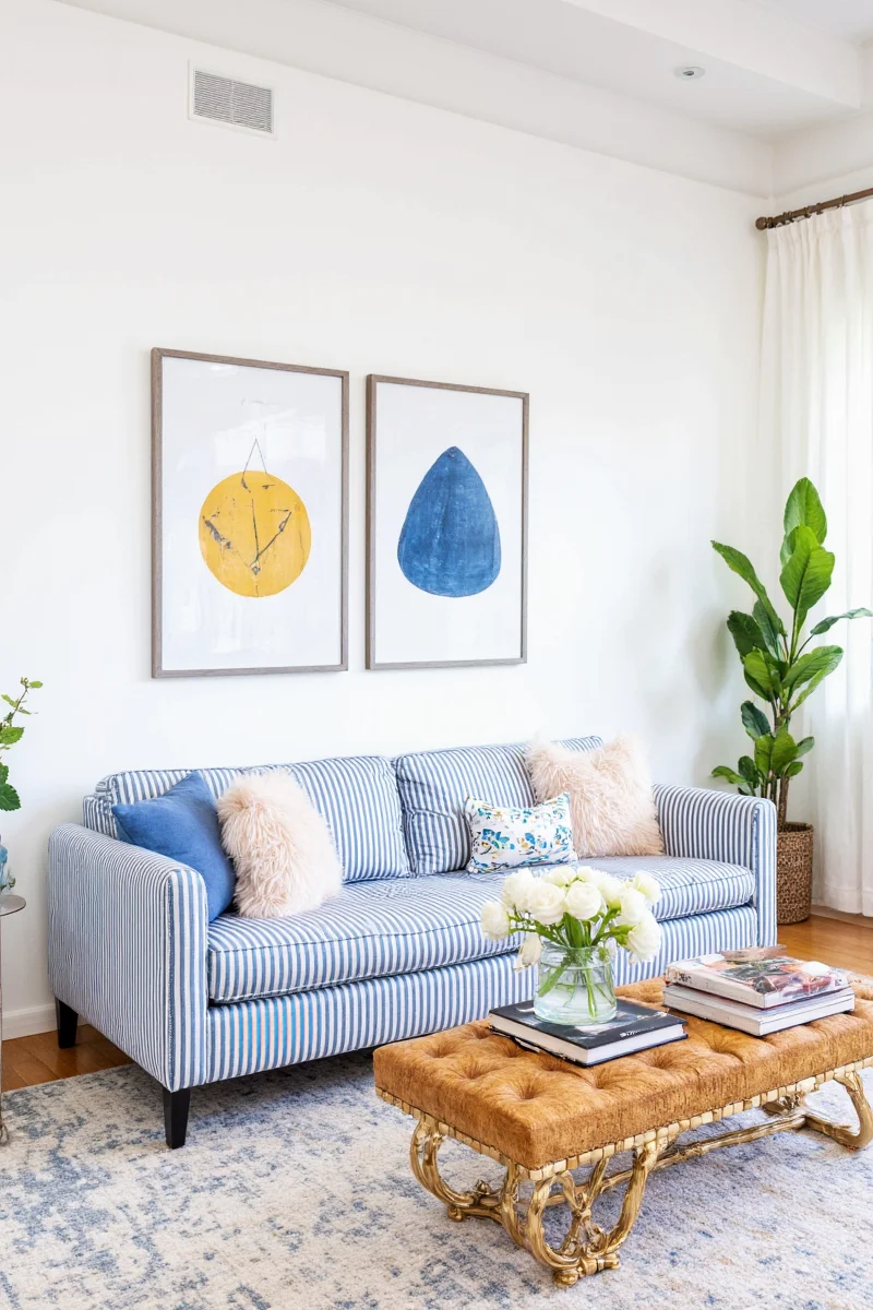 Coastal living room with blue and white striped sofa