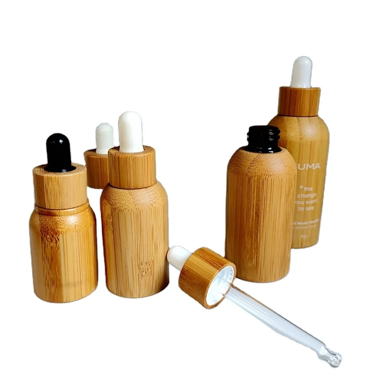 

Wholesales 10ml 20ml 30ml 50ml Eco friendly facial glass bottle with bamboo essential oil dropper bottle bamboo glass bottle, Customized