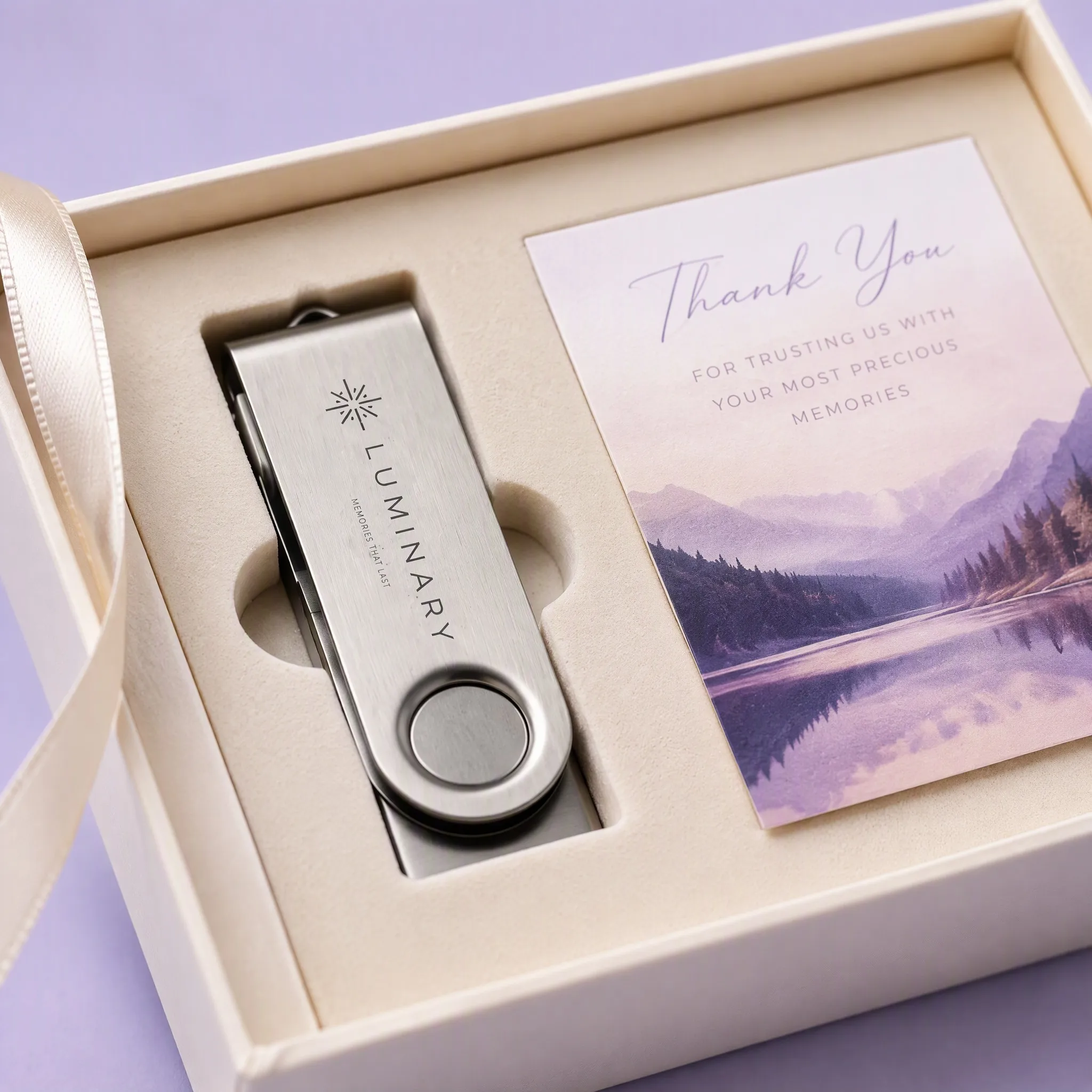 Close-Up Perspective Inside the Ivory Gift Box Showing Precision Velvet Foam Tray, Steel USB Drive, and Satin Ribbon