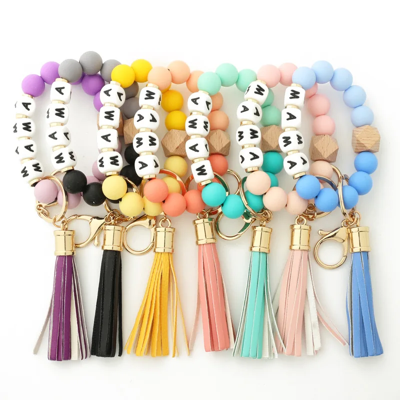 

2022 New Style Mother's Day Gifts Keychain Leather Tassel Wooden Beads Mama Silicone Beaded Bracelet for Mom, 7 colors