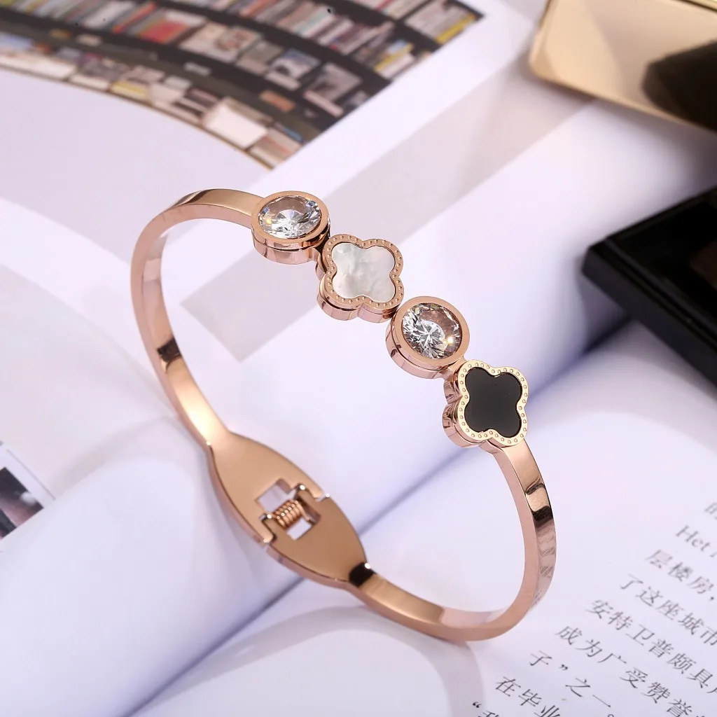 

The new Gold plated Stainless Steel Double-sided Four-leaf Clover with Diamond Opening Bracelet for Women bangle