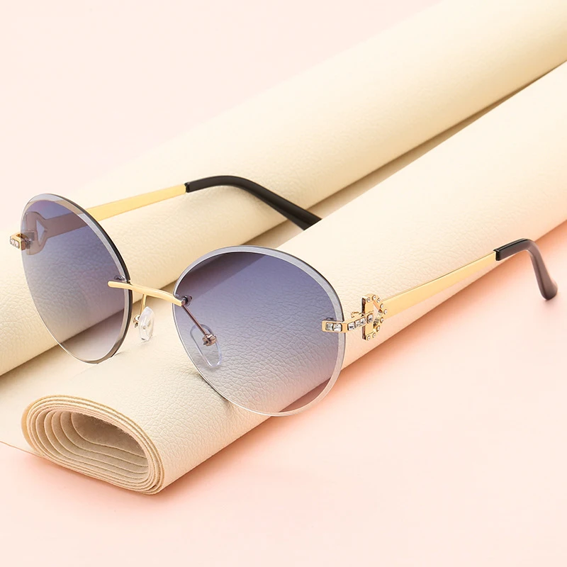 

Fashion Frameless Women Sunglasses China Factory Sale Ocean Lens Metal Sun Glasses With Diamond Decor