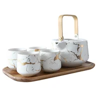 

Amazon's Active Demand Black and White Marble Tea Service Set Ceramic Large Tea Pot with Wooden Tray and 4 Pieces Tea Cups