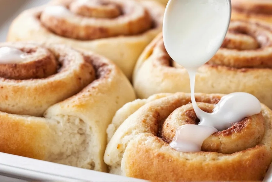 Perfectly glazed cinnamon rolls with smooth, shiny topping drizzled over warm pastries