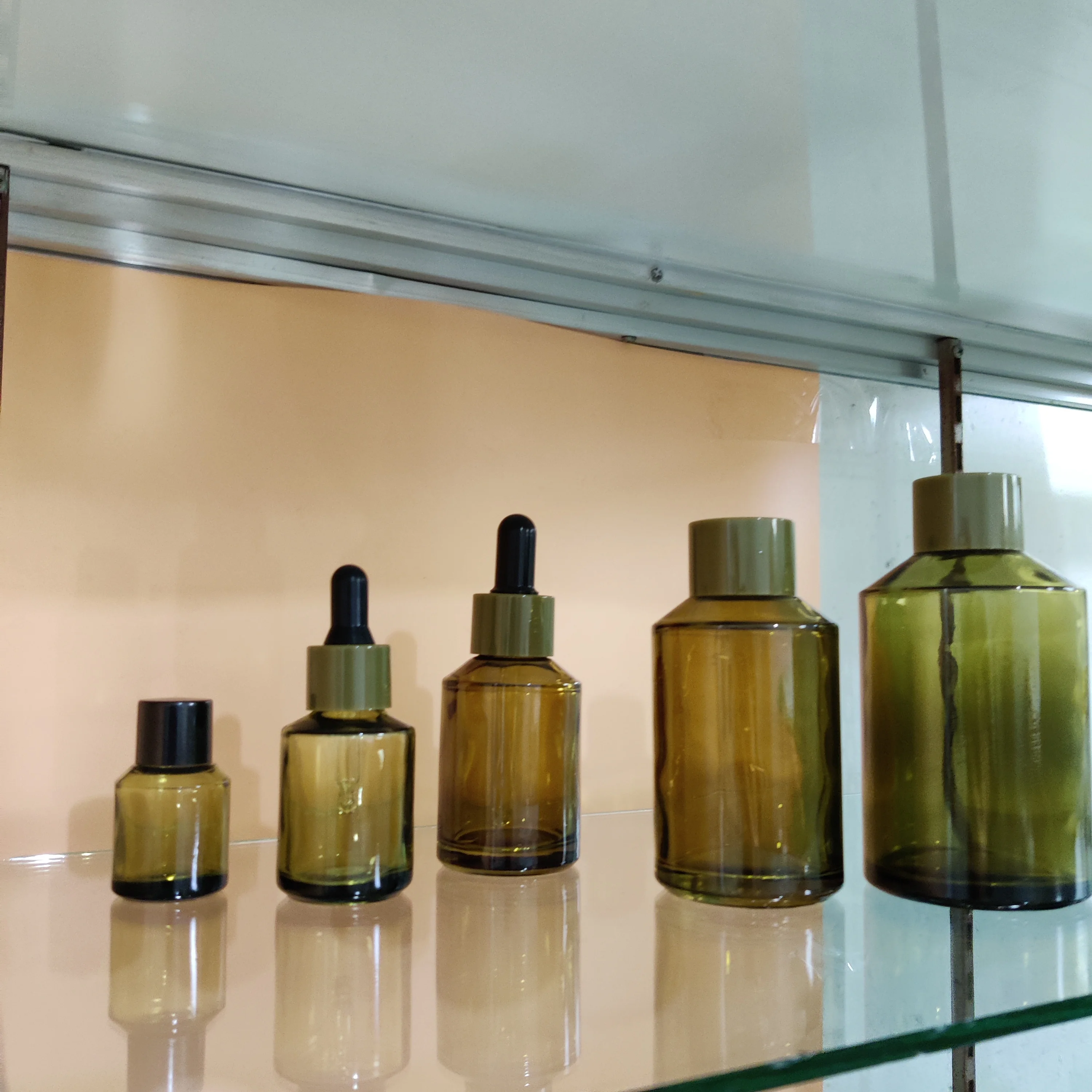 

Factory hot sell cosmetic olive green slant shoulder glass bottle for perfume