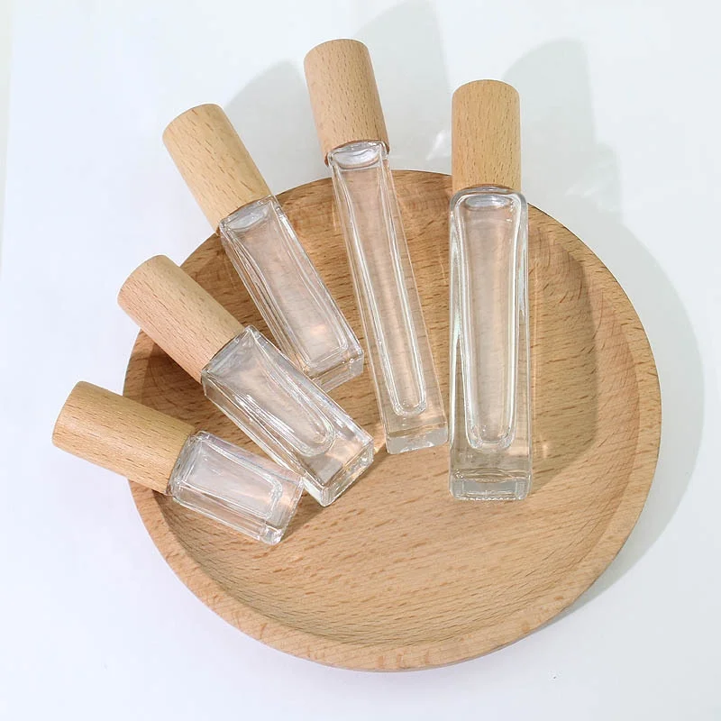

3ml 5ml 10ml 15ml Wholesale Wooden Cap Empty Essential Oil Packaging Colored Roll On Perfume Glass Bottle