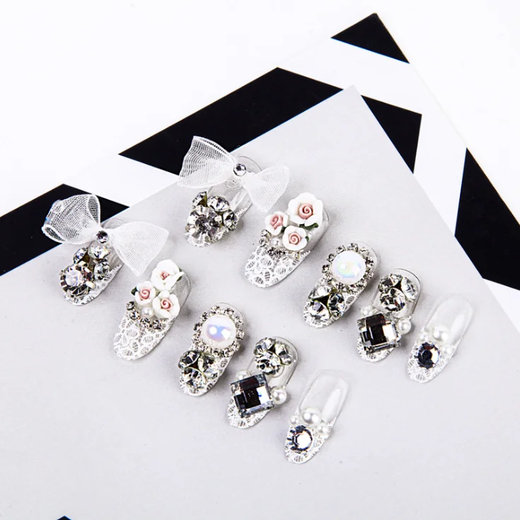 

2021 new design Carved bridal finished white flower rhinestone pearl diamond bow 24 pcs Nails Artificial Fingernails