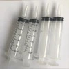Large plastic syringe with extension tube