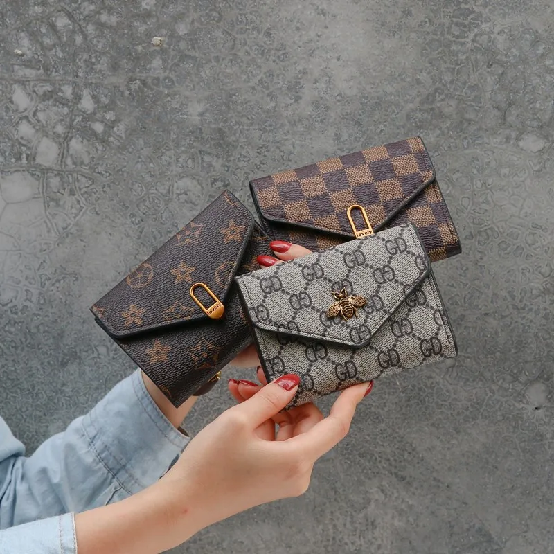 

Wholesale Luxury Designer Casual Lattice Ladies Purses Pu Leather Short Money Card Wallet 2021 For Women