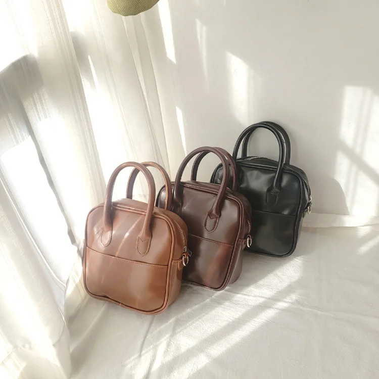 

2022Portfolio female wild solid color handbags women casual retro pu leather small square shoulder messenger bag lady briefcases