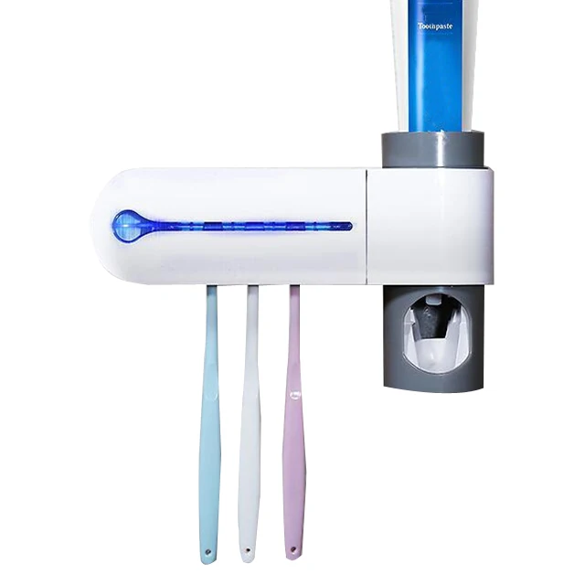 

Toothbrush sterilizer automatically squeezes toothpaste tooth holder