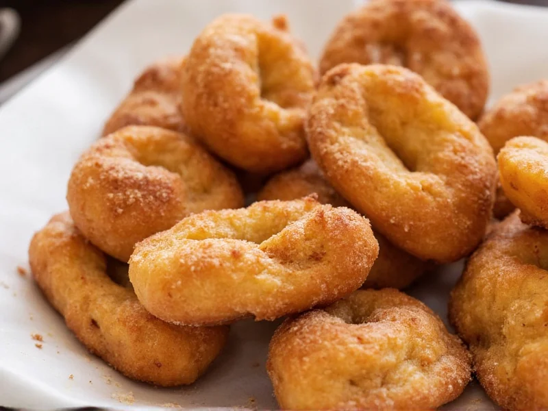 Cinnamon-dusted homemade apple fritters closeup