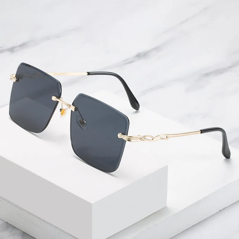 

Lmamba 2021 New Fashion Square Rimless Frmae Trimming Ocean Sun Glasses Trendy Metal Shades Sunglasses Women
