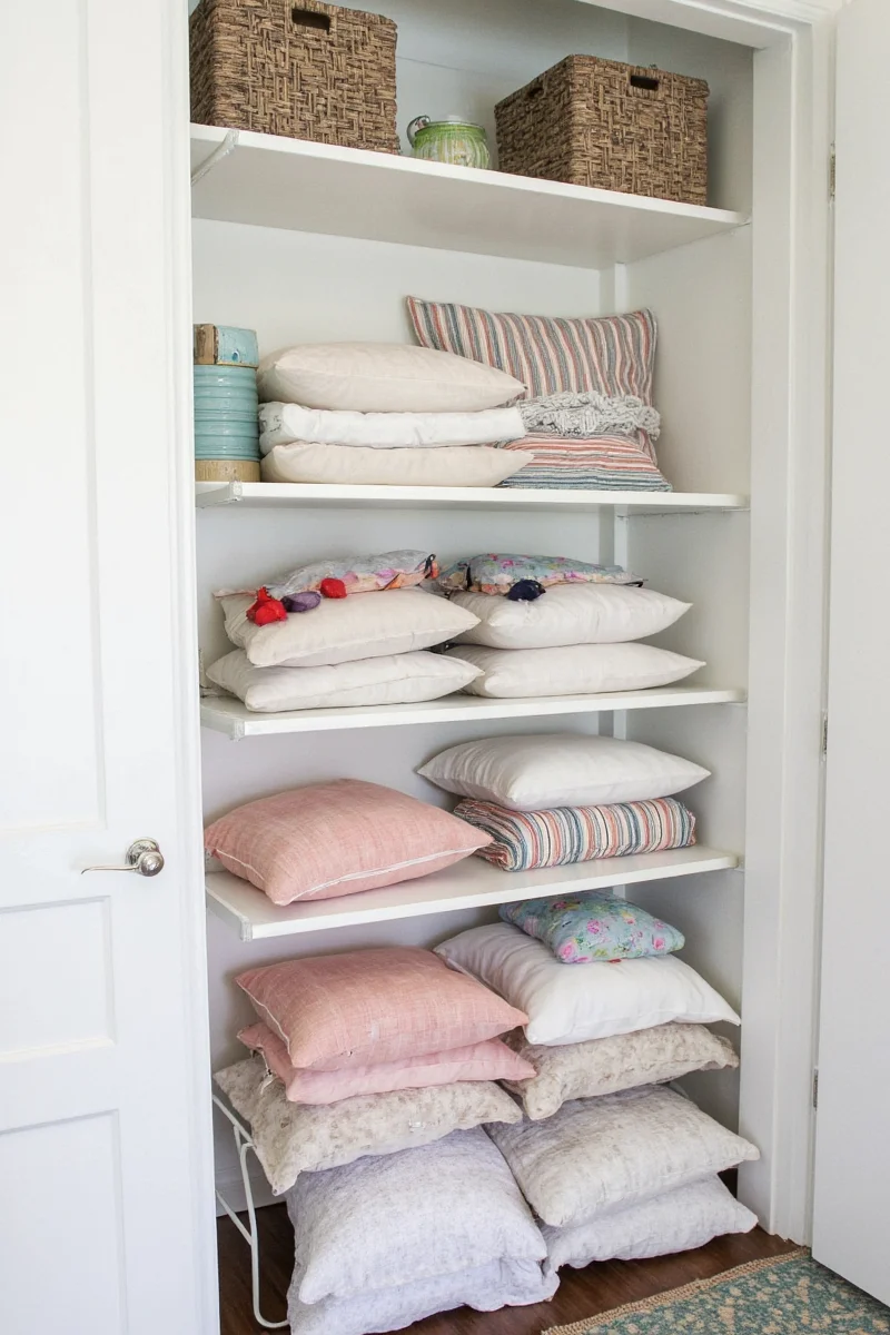 Floating shelves holding neatly stacked cushions