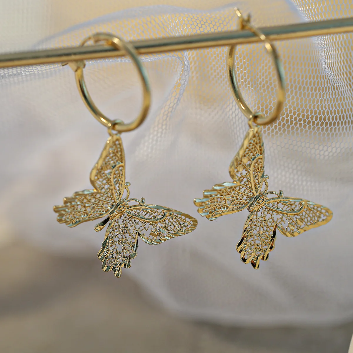

Butterfly 18k gold plated brass hanging hoop earrings factory suppliers in China