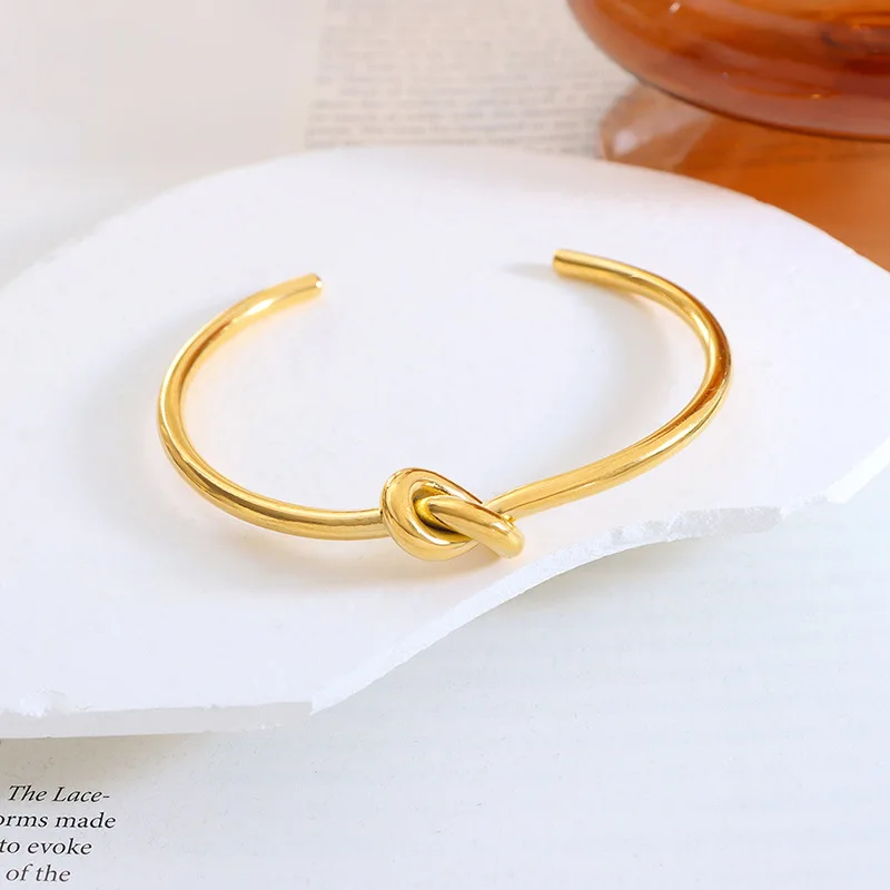 

Simple New Fashion Wholesale 18k Gold Plated Stainless Steel Elegant Knot Opening Adjustable Bangle Bracelets For Women