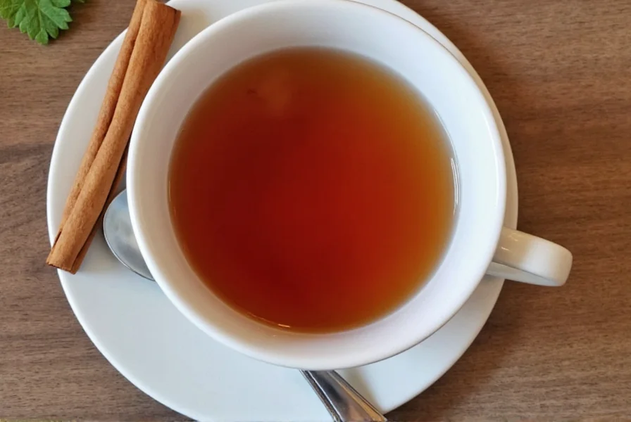 Close-up of cinnamon sticks simmering in a glass teapot with steam rising