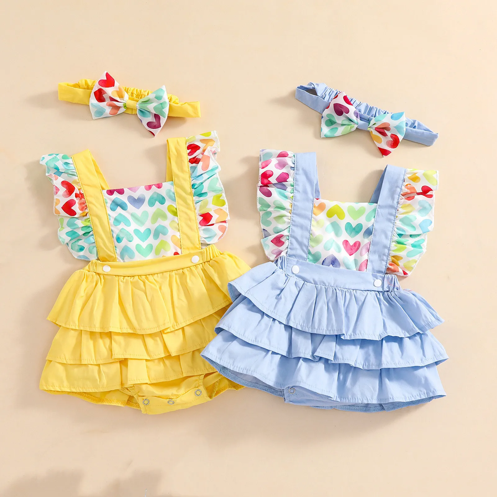 

Wholesale Baby girls jumpsuit ruffled sleeveless heart printed cotton dress romper and headband for baby, Picture shows