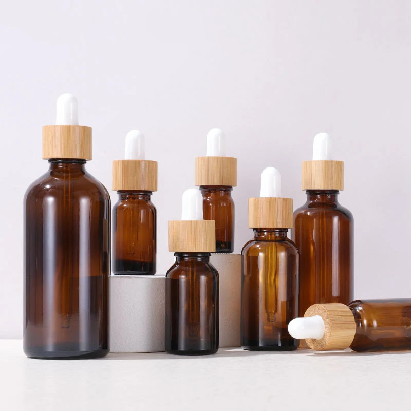 

Wholesale 1oz 30ml natural glass amber clear frosted dropper serum bottles with bamboo lid