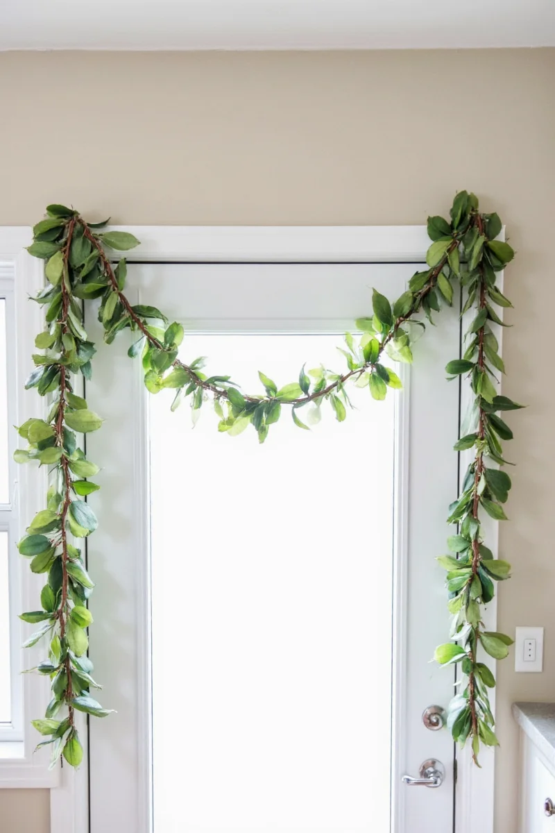 Using velcro strips to secure garland to a door