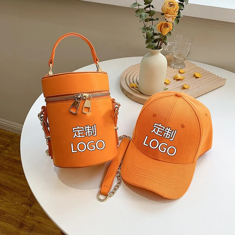 

2021 new textualized women's bag fashion NY handbag baseball cap set Western chain hand-held cross-slung bucket bag set, Picture