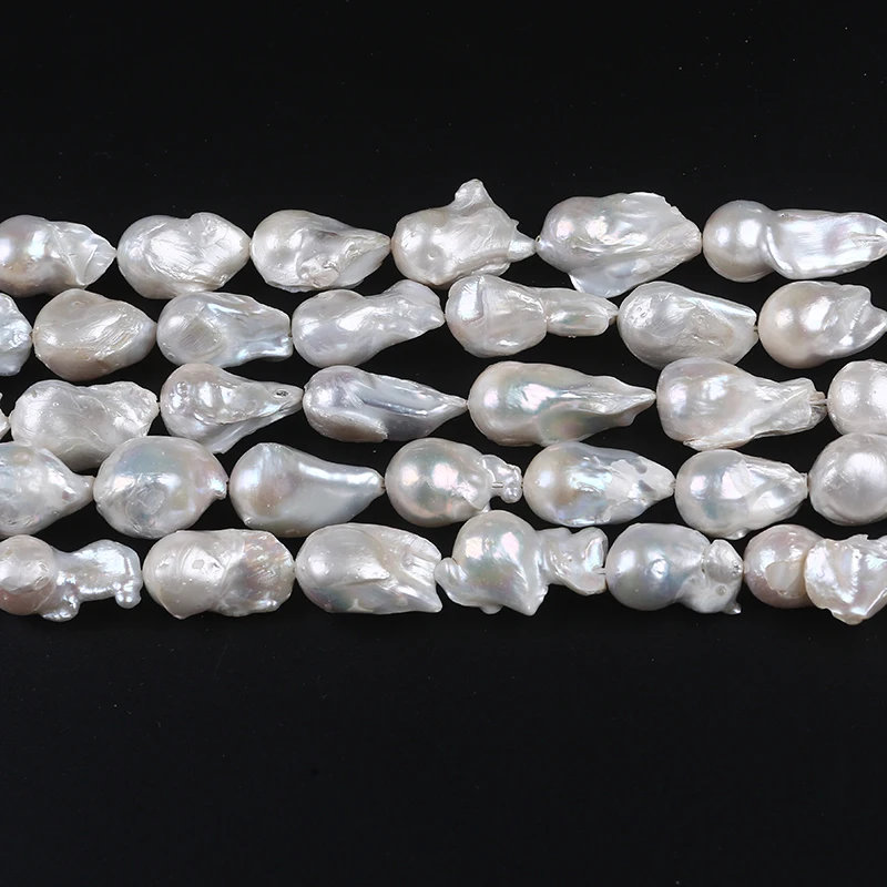 

Natural white  nucleated big baroque freshwater pearl bead strand