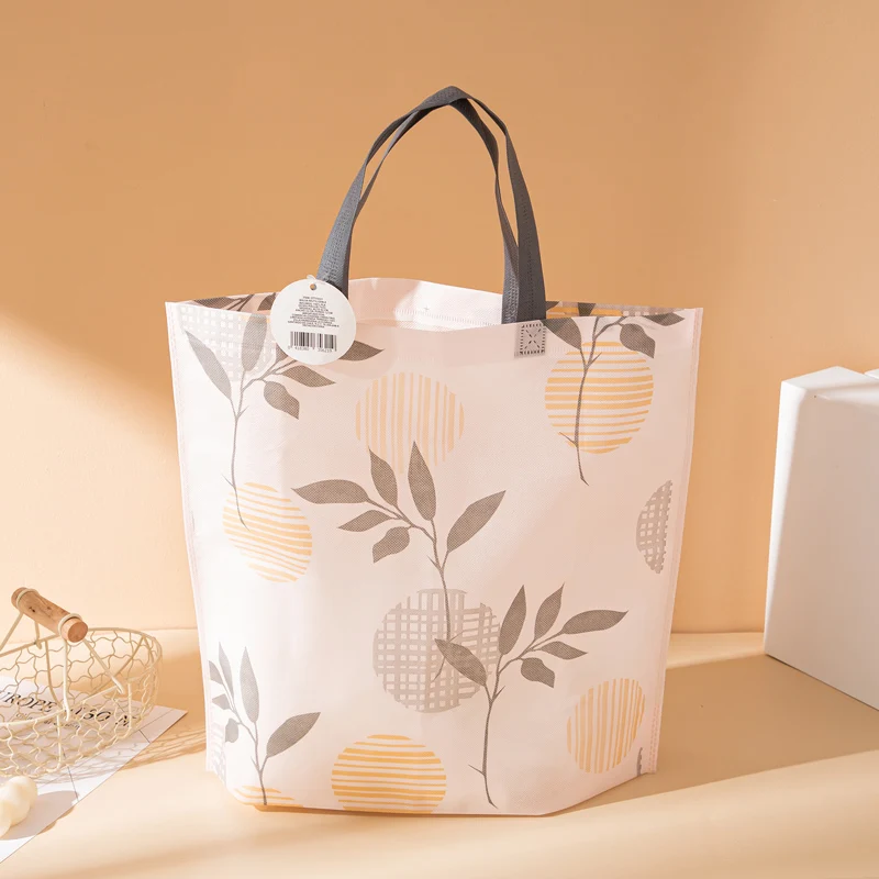 

Stock Promotional Colored Reusable Non Woven Tote Shopping Bag Leaf Printing TNT PP Packaging Bags