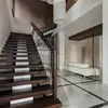 Indoor tempered glass railing wooden handrail and solid wood steps staircase for man cup of tea