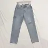 Wholesale Women's washed personality side cut nine points hole jeans