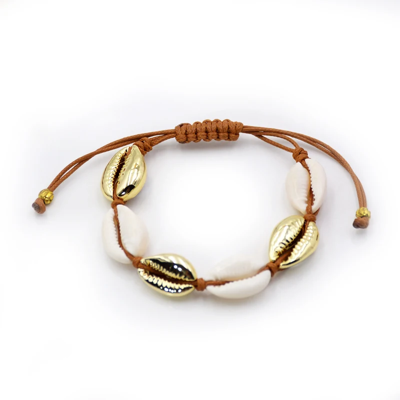 

Cowrie shell hand made bracelet Nature Puka White and gold sea shell bracelets Gold dipped Natural shell jewelry