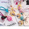 Korea 2019 new products Cheap and high quality custom cartoon silicone rubber key chain with colorful bell 041