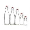 /product-detail/round-hot-sale-1000ml-750ml-500ml-250ml-100ml-swing-flip-top-glass-bottle-for-kombucha-tea-60789628393.html