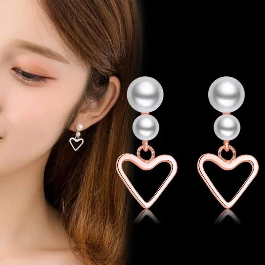 

Fashion new allergy resistant rose gold pearl heart earrings Korean version European and American female short earrings
