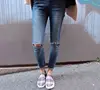 Factory OEM Women denim high waist cotton casual style slim ninth burr hole jeans pencil pants for sexy ladies