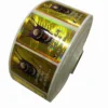 golden color rectangle hologram sticker with bar code in roll