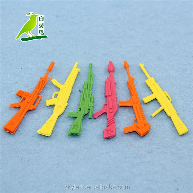 small plastic toy guns