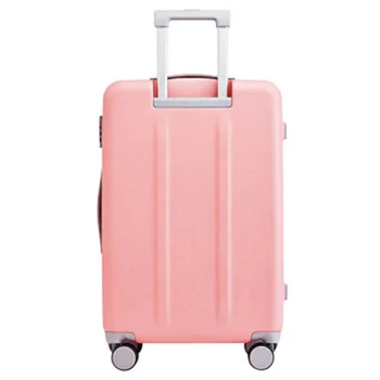 pink and green luggage with wheels