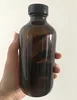 250ml amber transparent glass bottle for soft beverage/ milk with black plastic cap