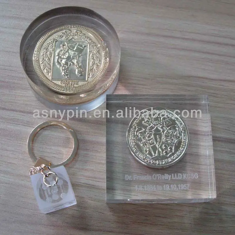 paper weight with embossed coin inside