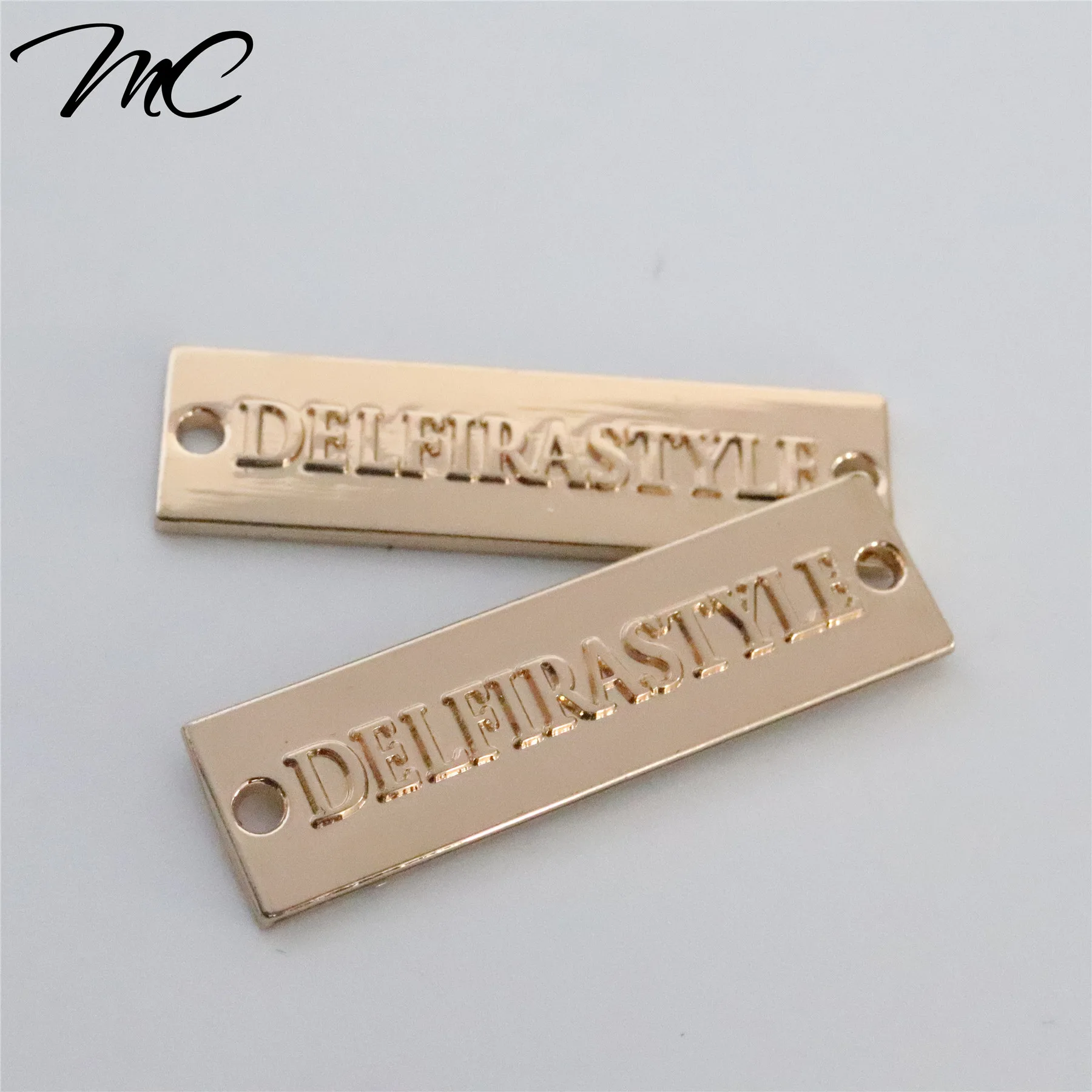 

Gold Embossed Logo Custom Metal Label For Scarf