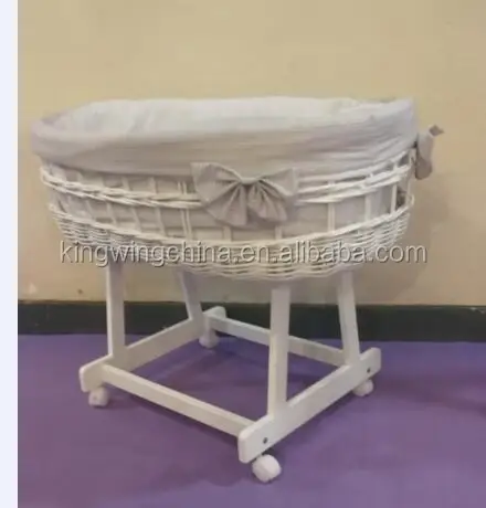 white moses basket with drapes