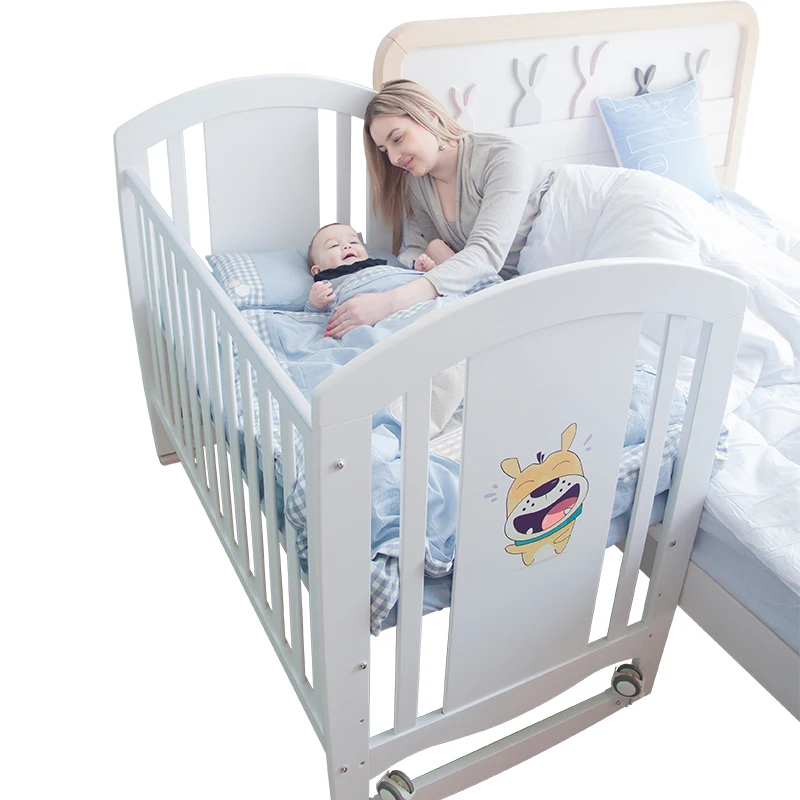 baby bed attached to bed