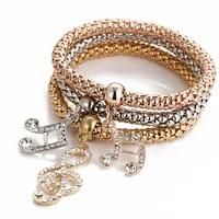 

Fashion Three Colors Gold Music Note italian charm bracelet set for women wholesale N95200