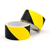 High visibility floor warning tape highlights hazards to alert of danger