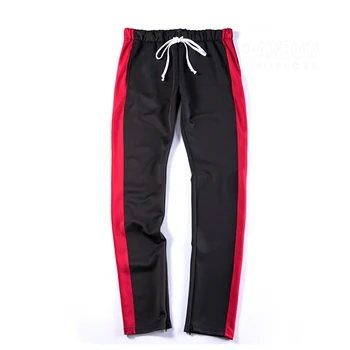 striped track pants with ankled zippers