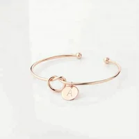 

Rose gold metal Simple Love Knot With Round Disc Engraved Words Bridesmaid Gift Jewelry Initial Bangle Bracelet