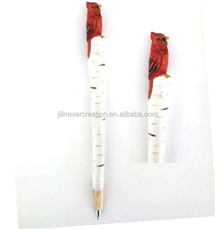 carved wooden pen